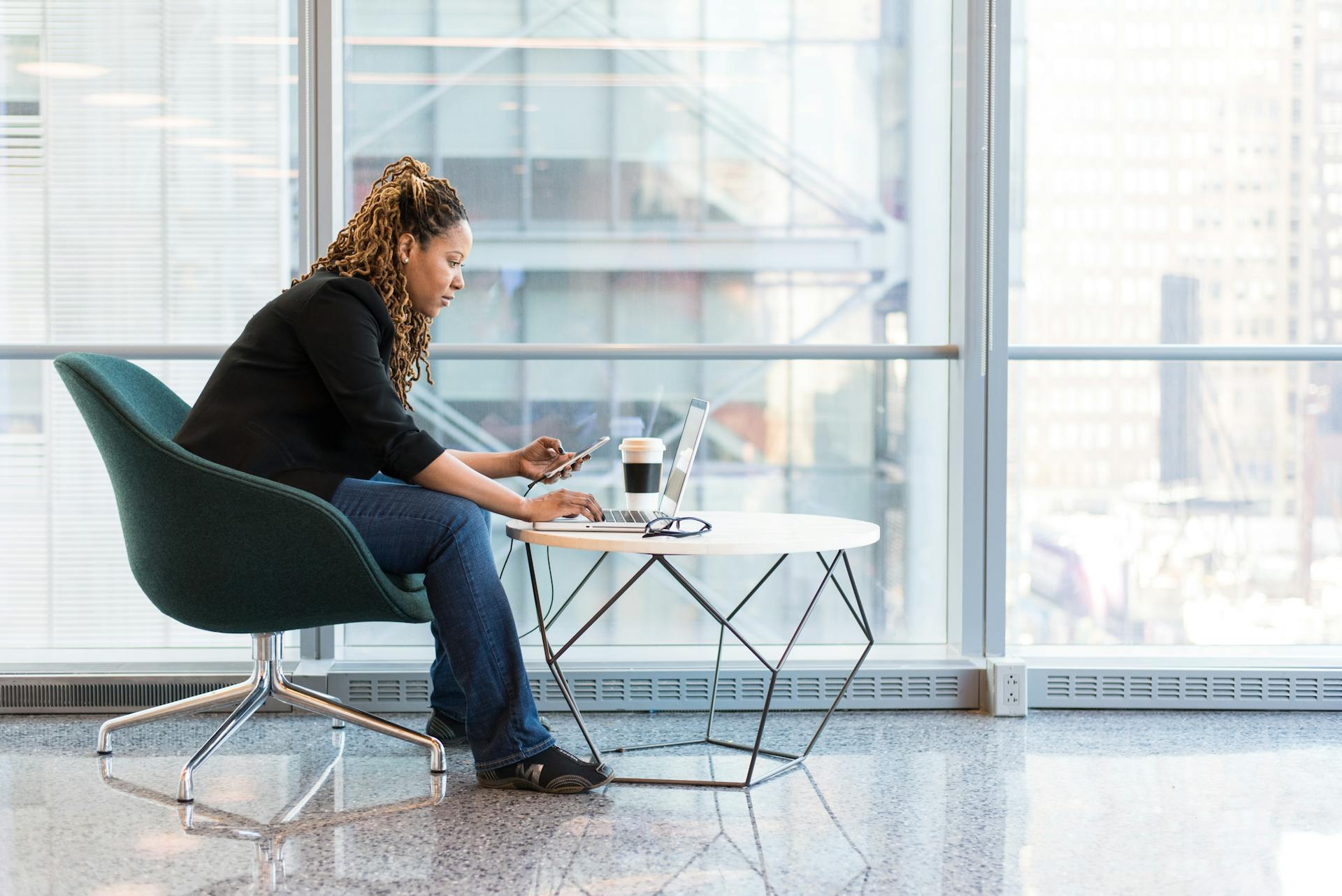 woman-sitting-on-blue-and-gray-chair