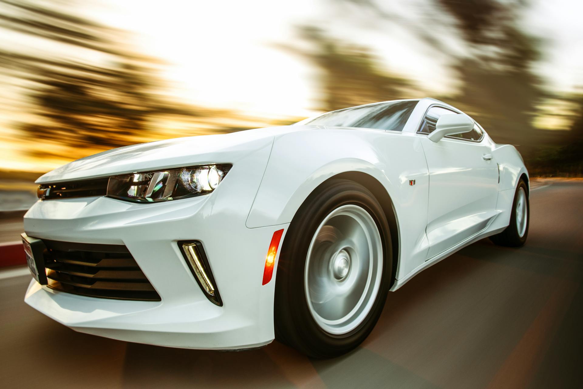 close-up-photography-of-white-chevrolet-camaro