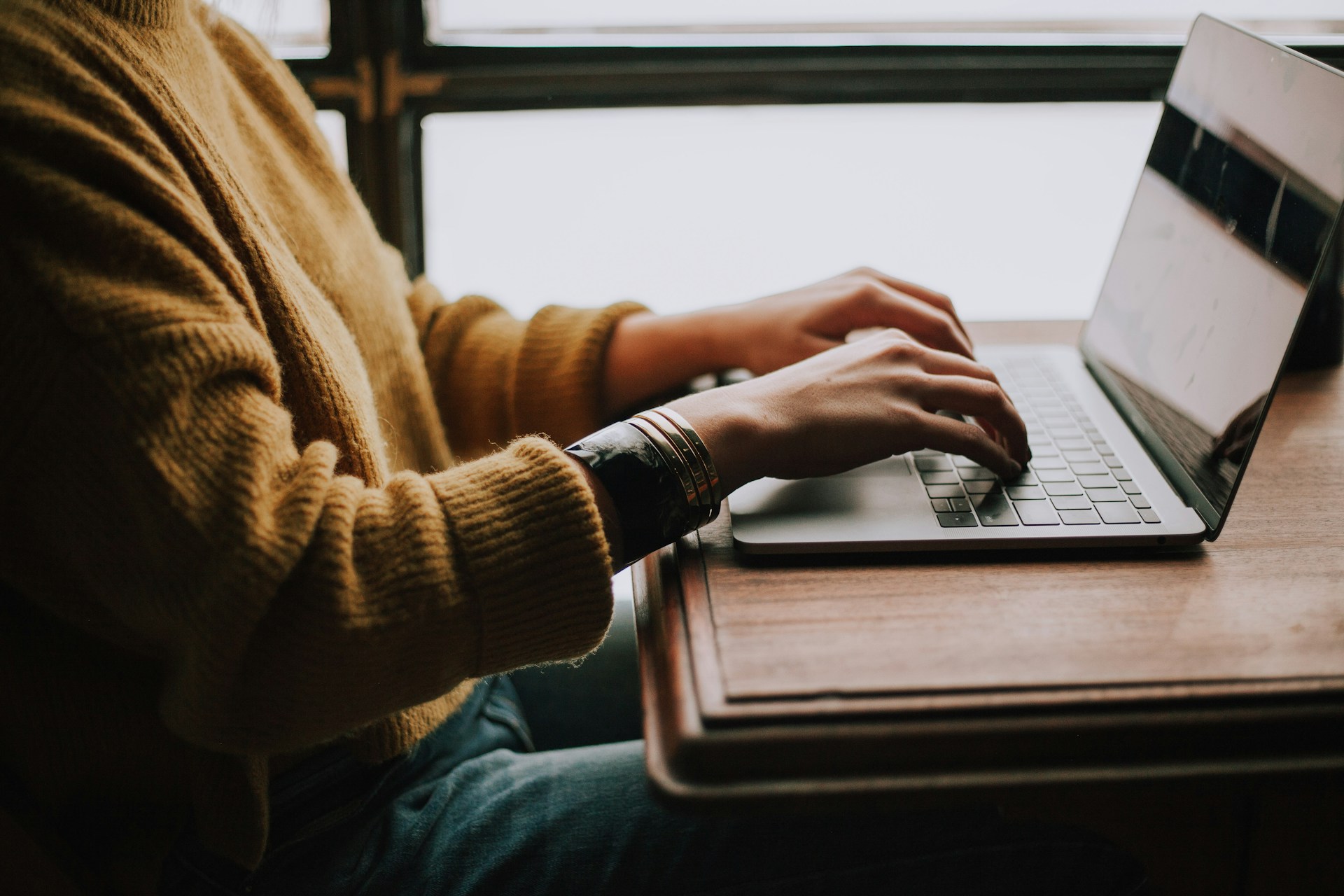 person-sitting-front-of-laptop