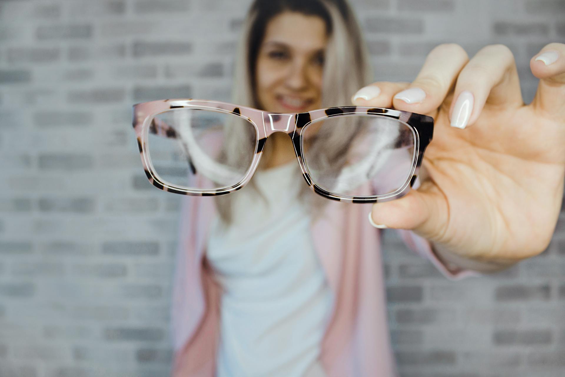 selective-focus-photography-of-pink-and-black-framed-eyeglasses