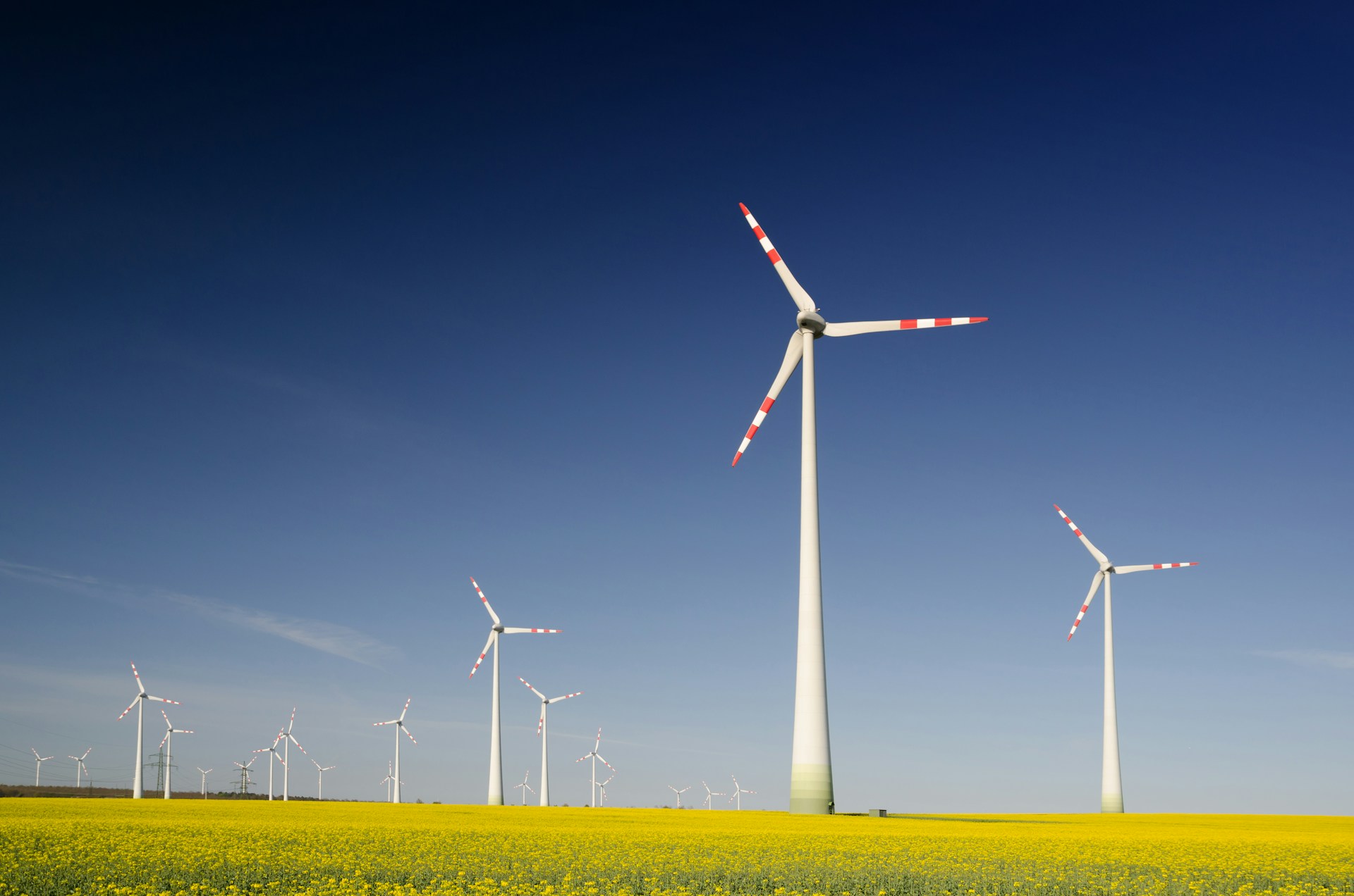 windmills-on-grass-field-at-daytime