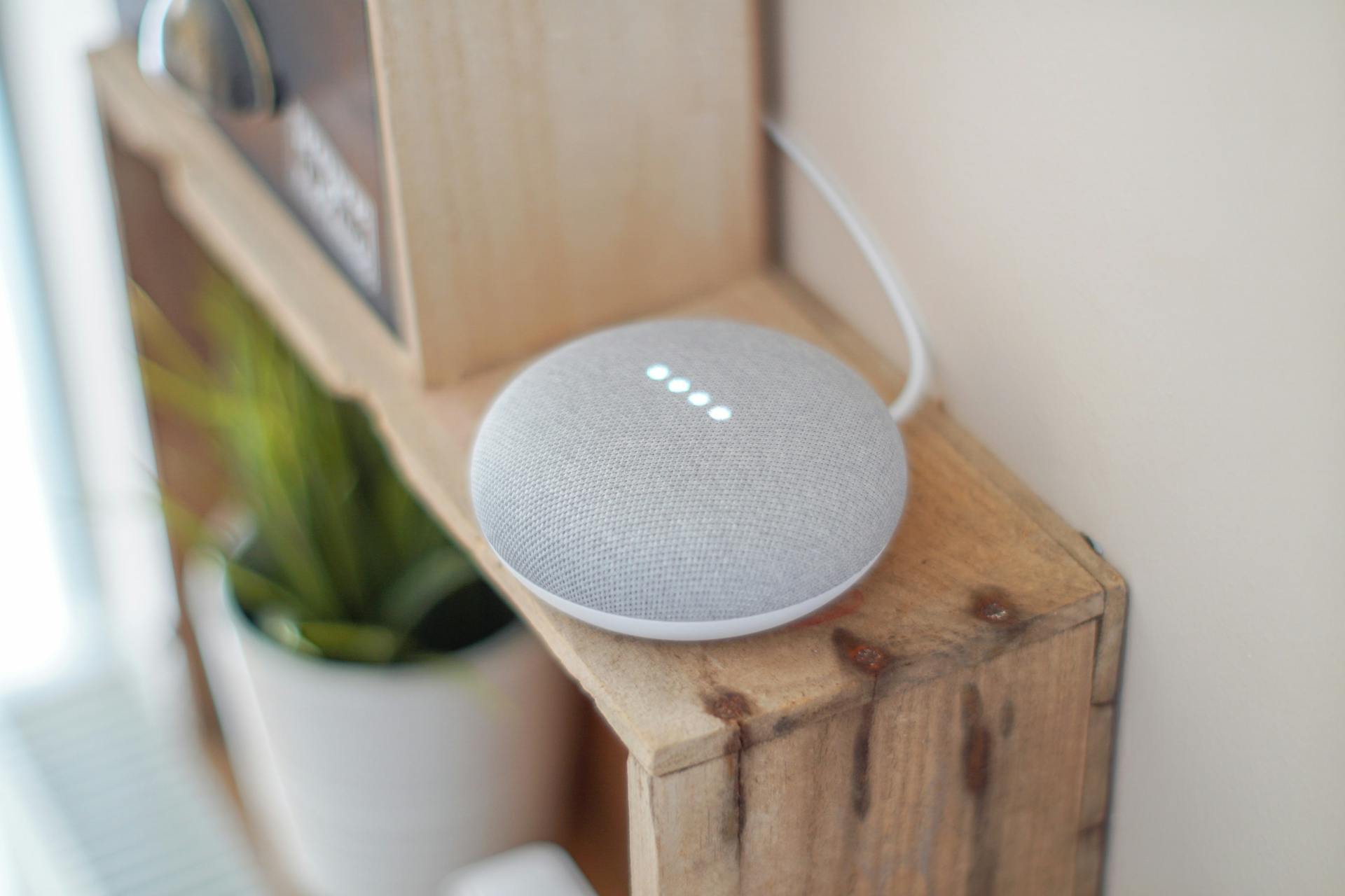 round-grey-speaker-on-brown-board