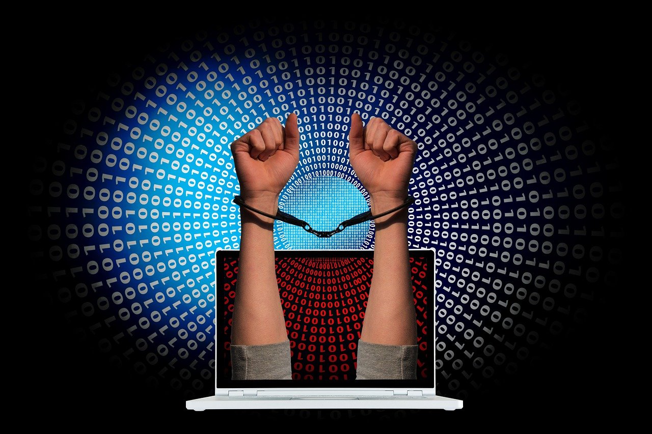 crime-handcuffs-laptop-binary-code