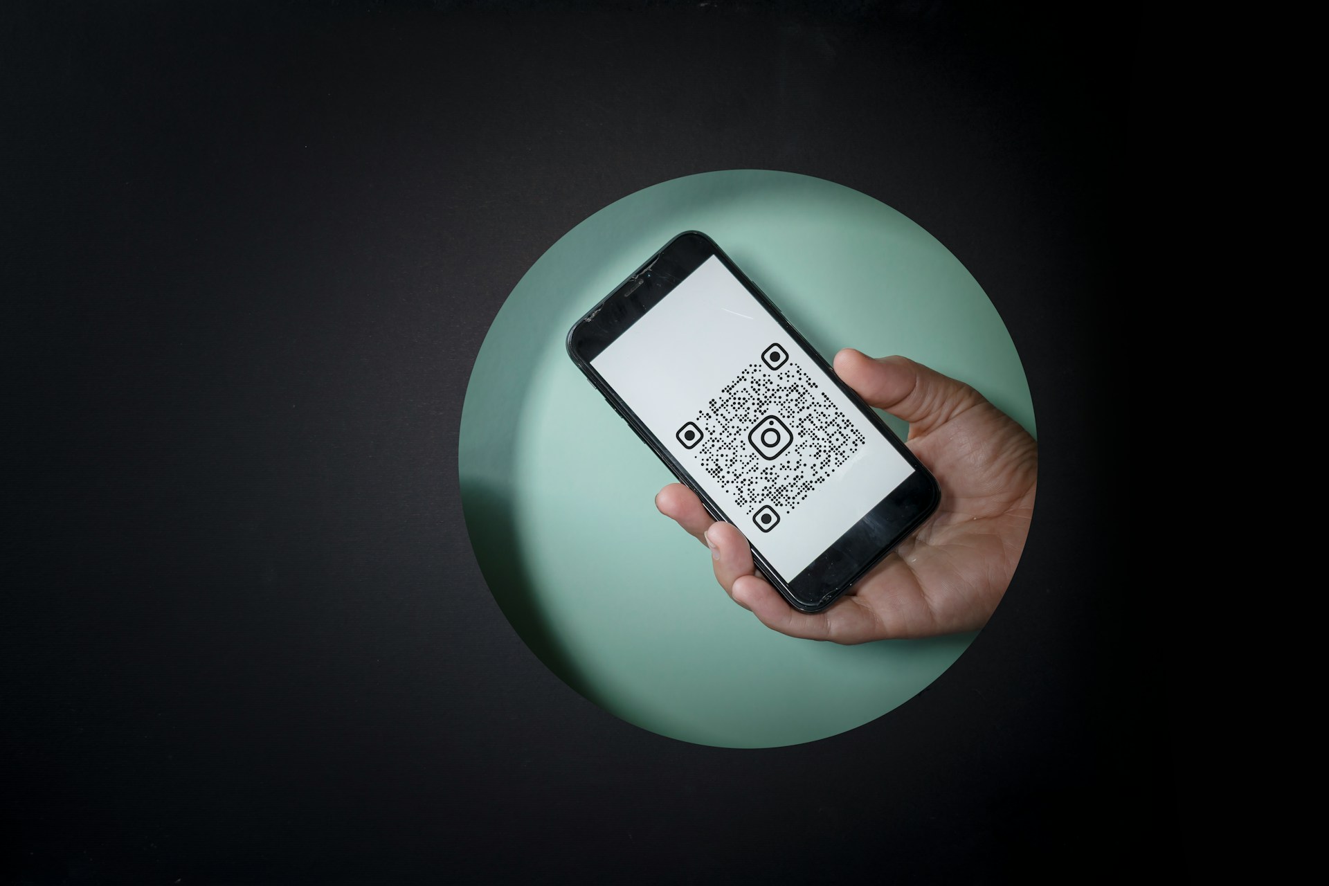 black-and-white-digital-device-on-green-round-plate
