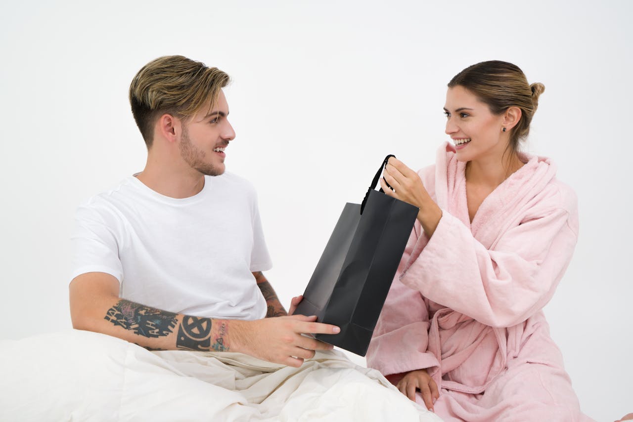 man-and-woman-holding-black-tote-bag
